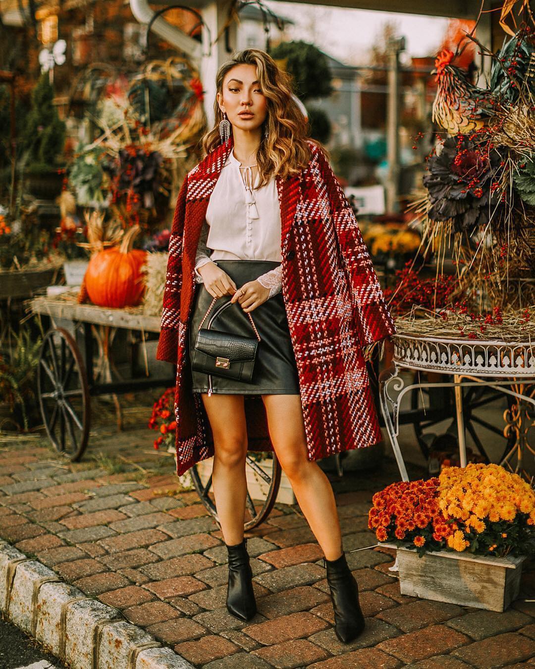 Checkered coat with black leather skirt and matching boots for fall 2021