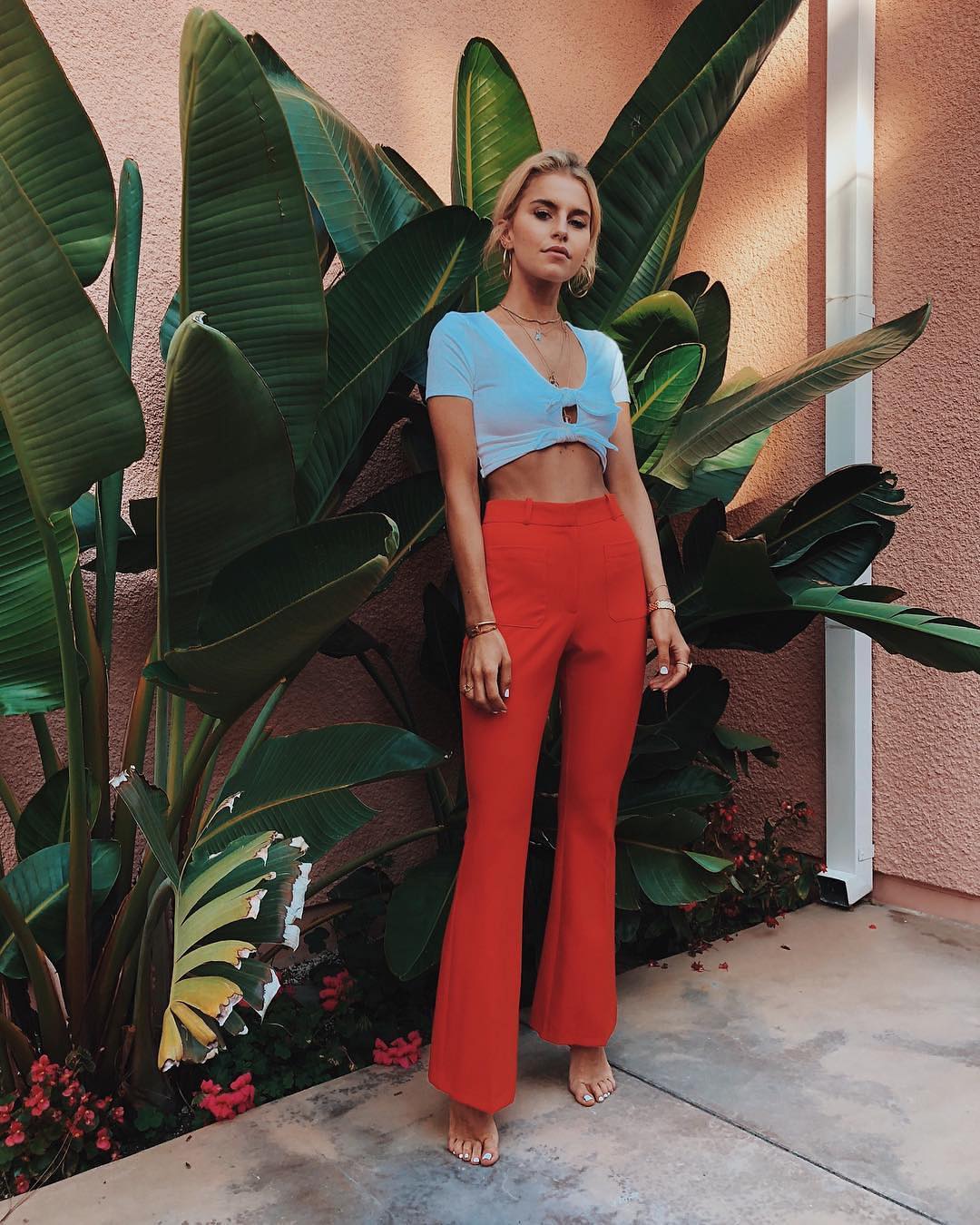 White crop top and red flared pants for summer parties 2021