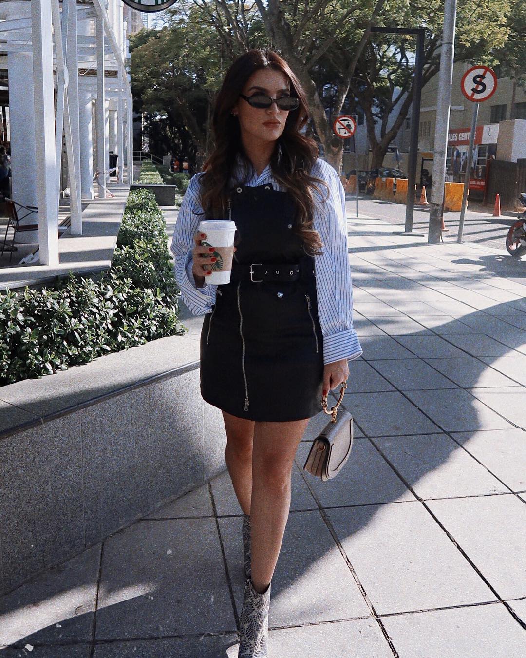 Black Biker Style Dress With Zip
Detailing And Oversized Striped White Shirt Outfit
