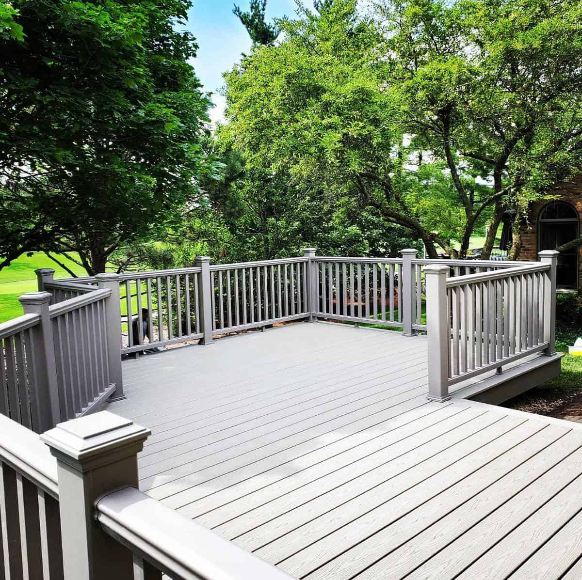 gray patio railing trees