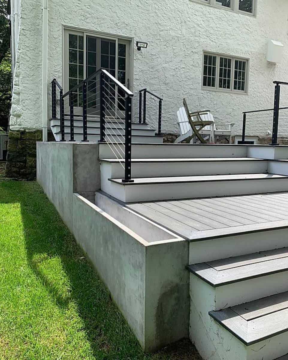 stepped gray deck, black railing 