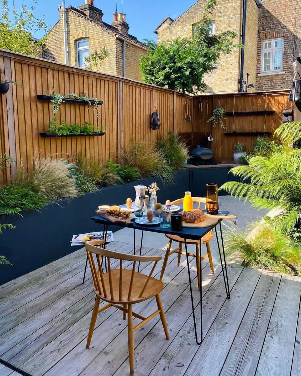 Light brown wooden terrace, large wooden fence, breakfast 