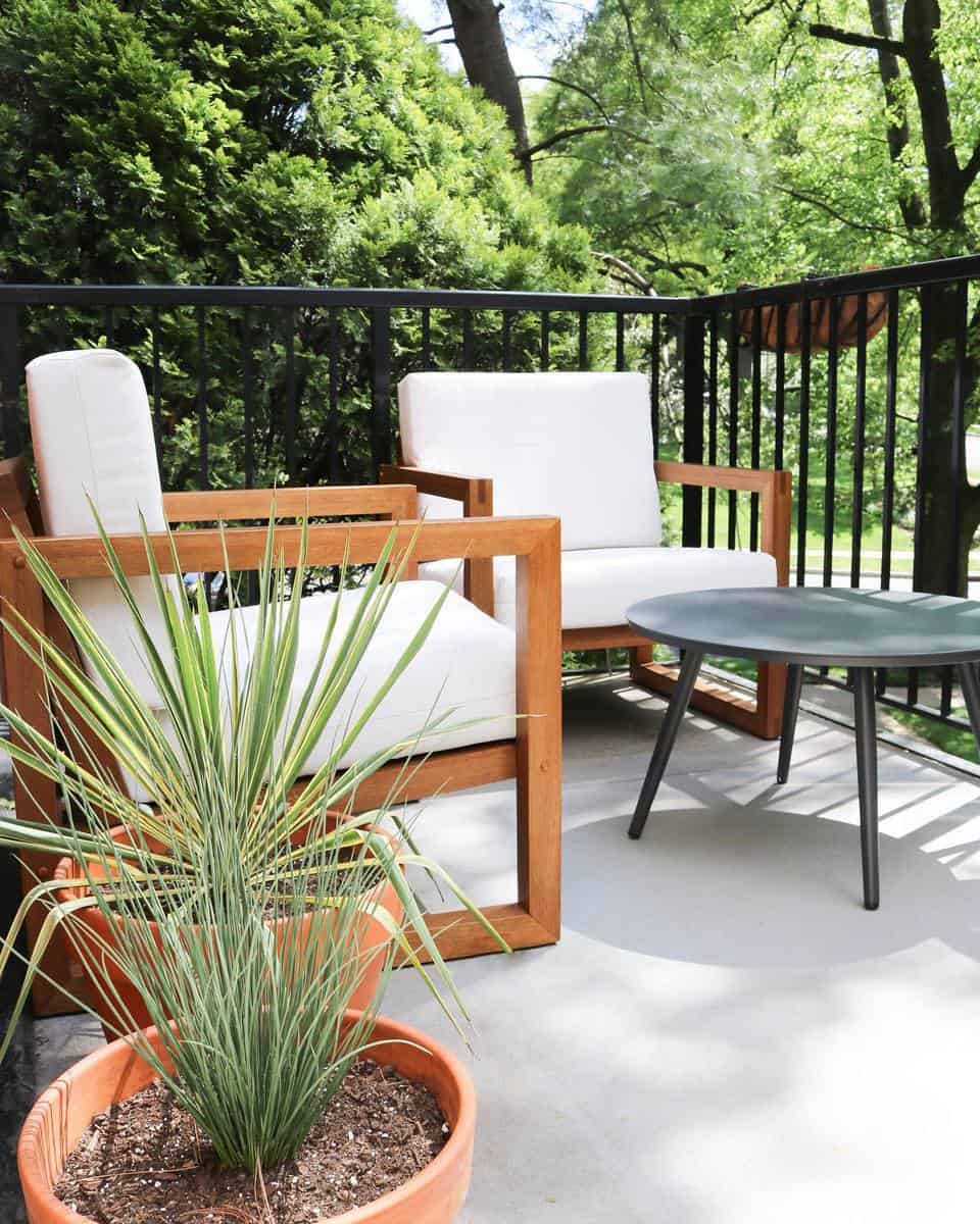 Simple two-tone cement potted plants with black railing