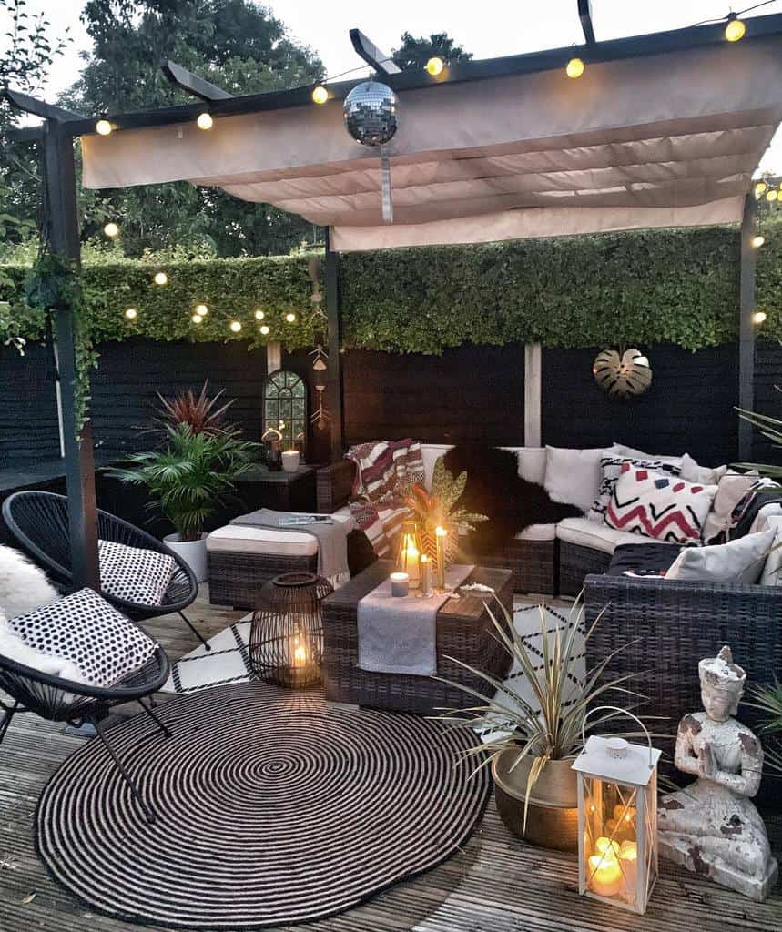 cozy wooden terrace with wicker furniture, candles 