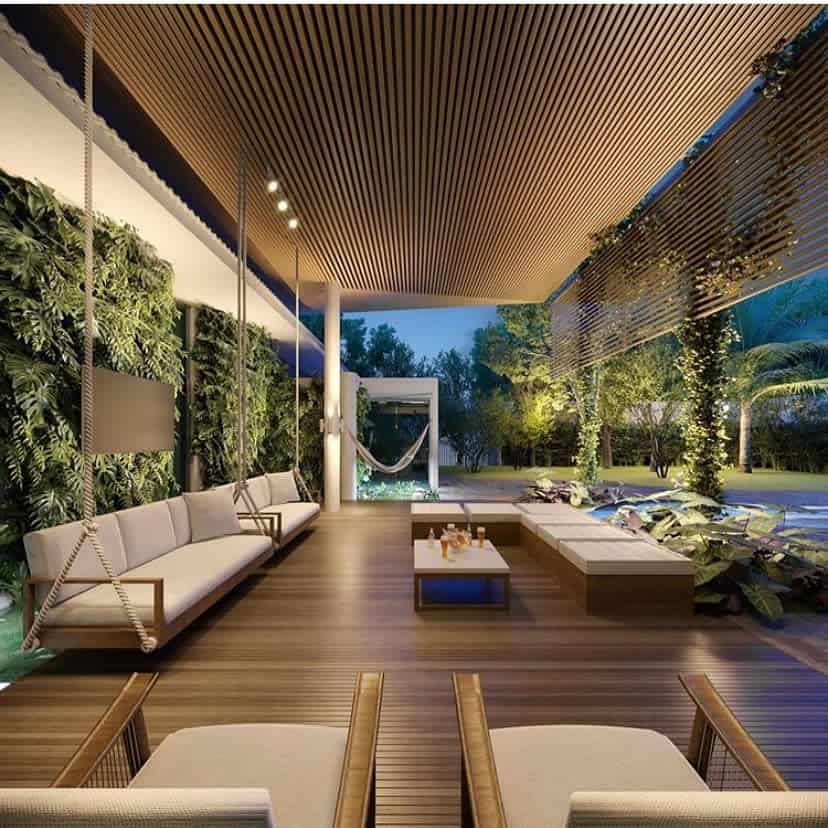Large luxury deck hanging sofas with vertical plants