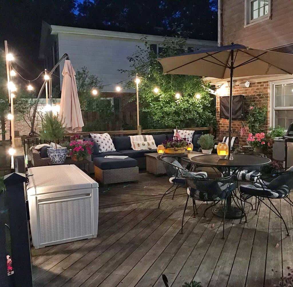 Wooden deck, outdoor table, wicker sofa, stringed lights
