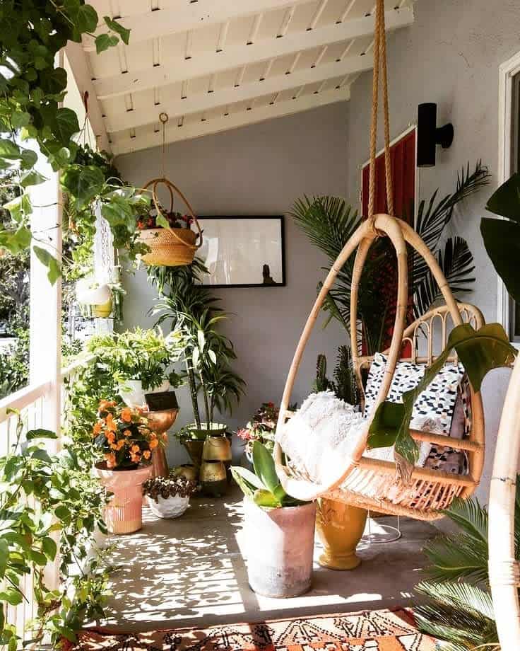 Crowded Porch with Hanging Egg Chair Plants