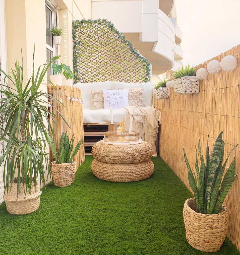 Small space in the backyard, pallet sofa, wicker, potted plants, artificial grass