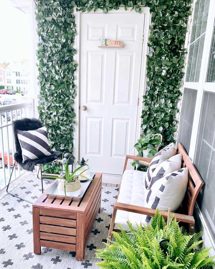 small vertical garden with wooden furniture on the veranda 