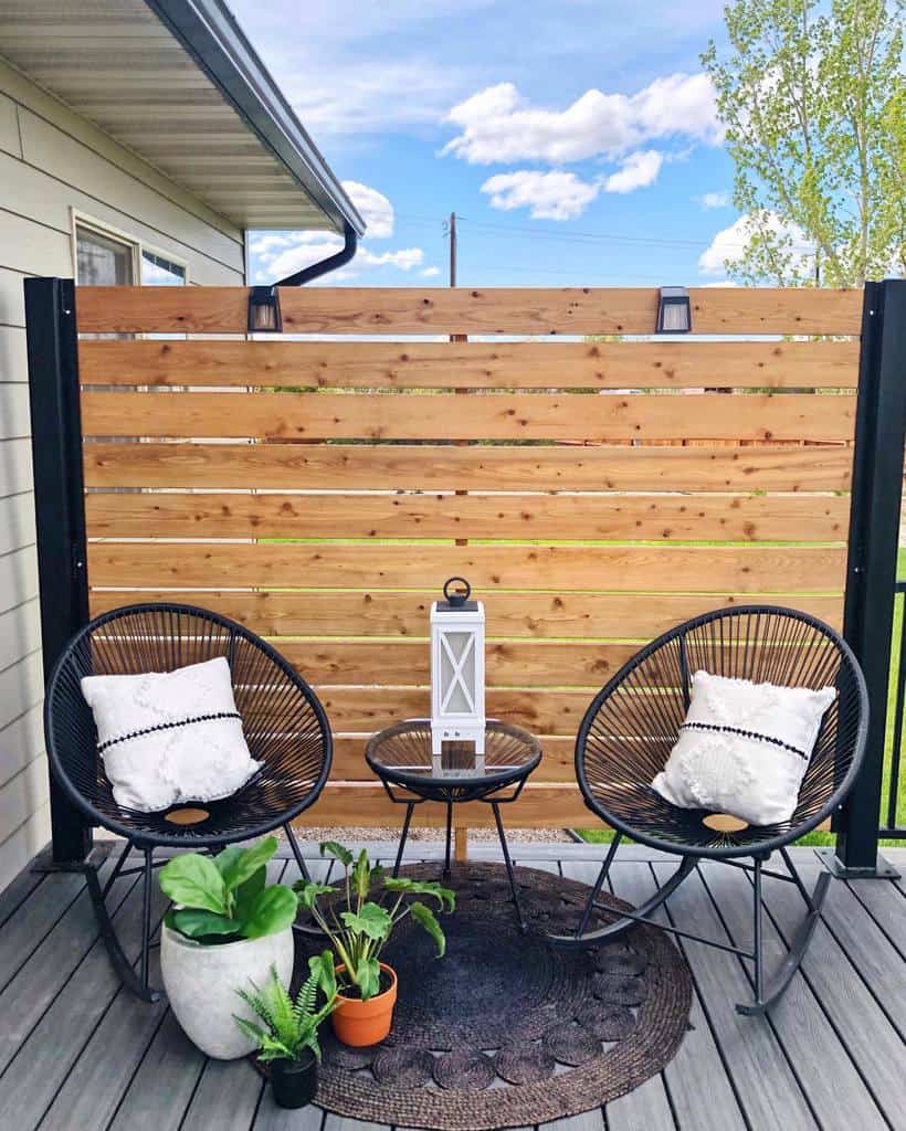 Small terrace with wooden privacy fence 