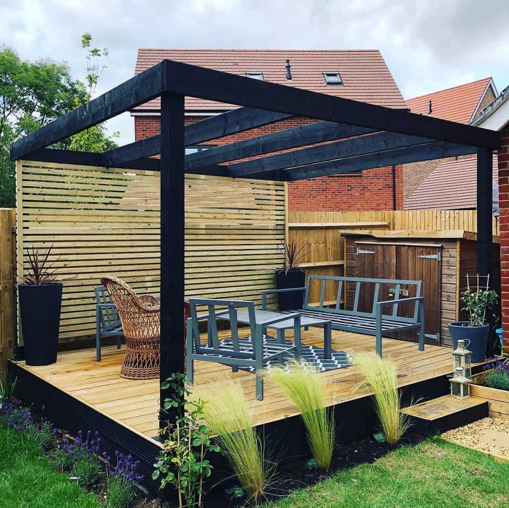Wooden terrace with black painted pergola 