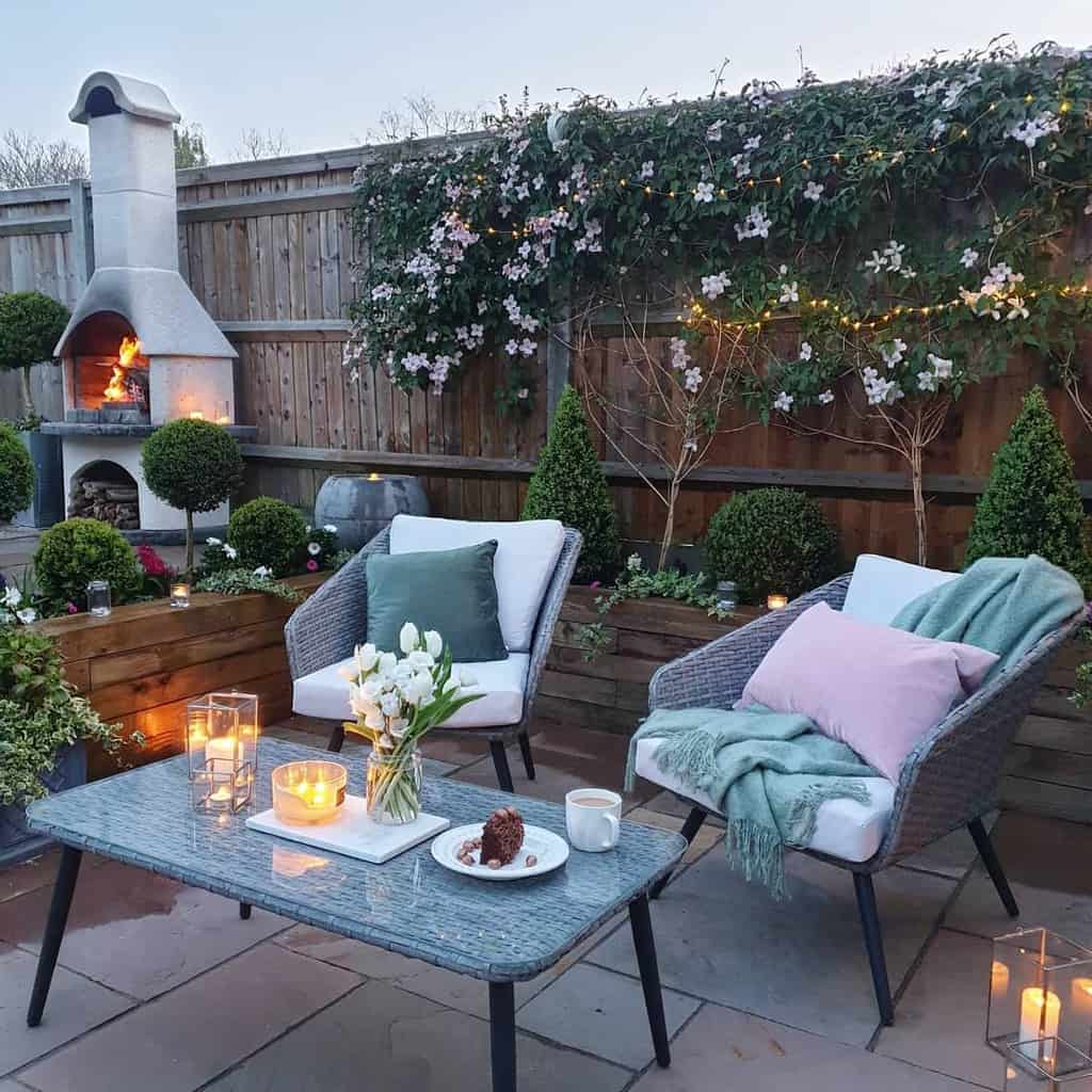 Backyard patio with fireplace and wooden partition 