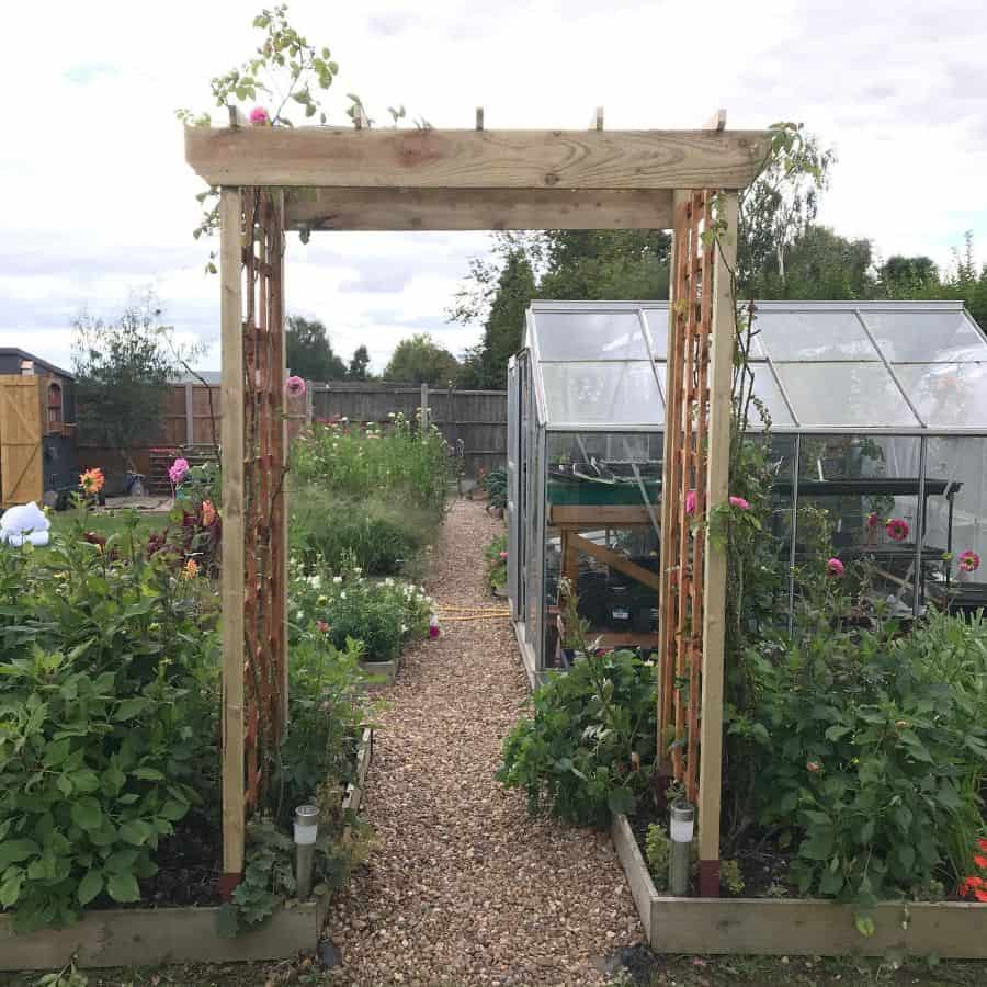 Espalier vegetable garden with greenhouse
