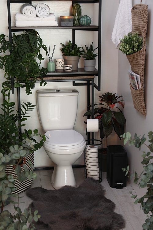 Plants around the toilet seat in the bathroom 32
