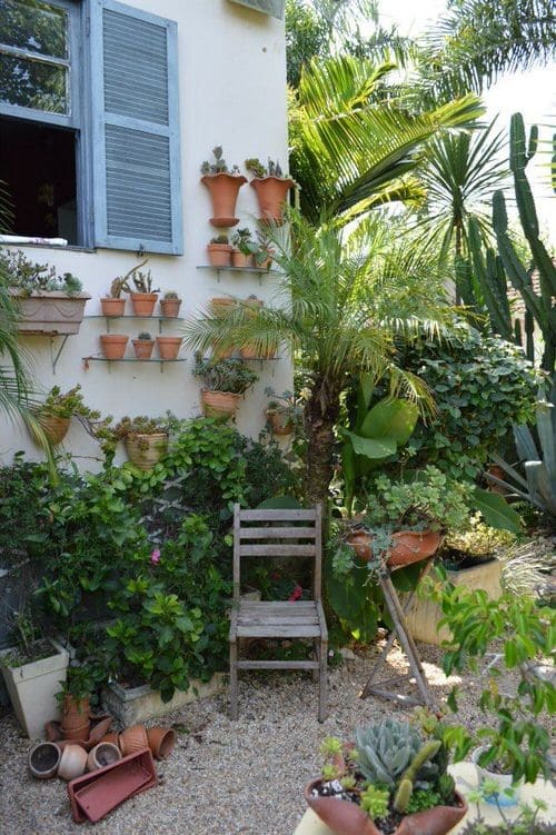 Vintage wooden chair and hanging pots