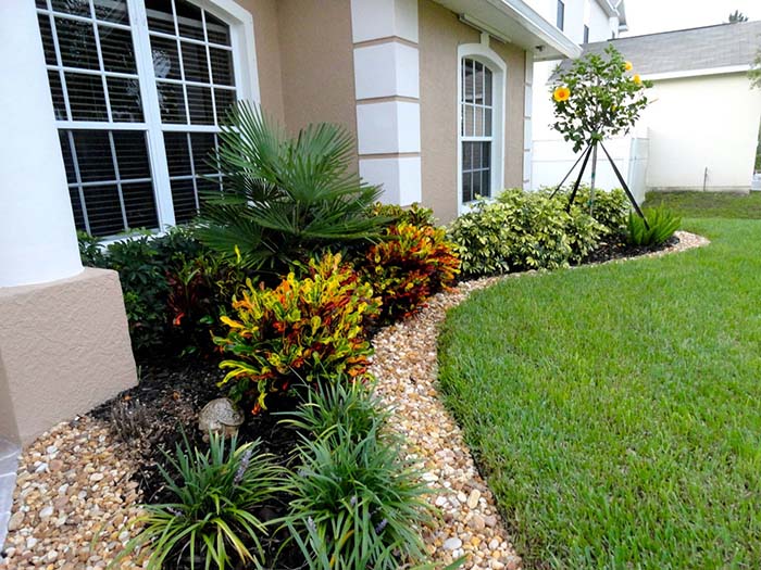 Landscaping around the house with stones